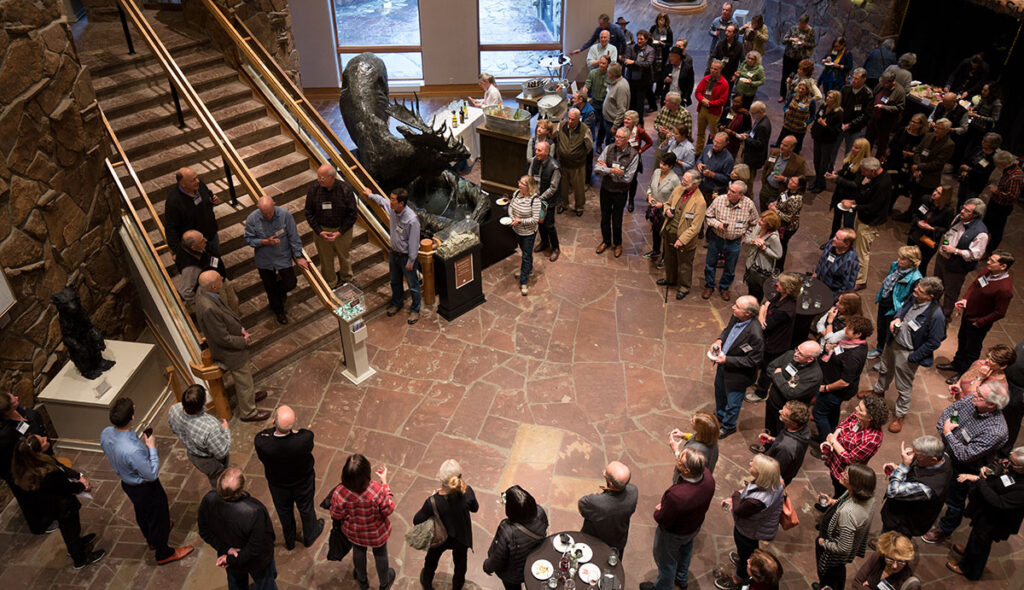 Fellows gathering in a lobby.
