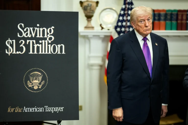 Donald Trump standing sullenly in front of a sign that says Saving $1.3 Trillion.